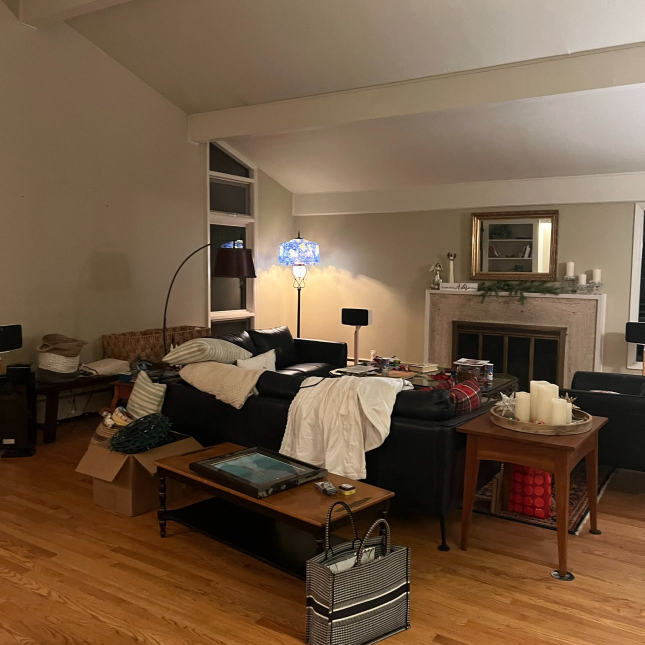 a disheveled living room space before day with a designer