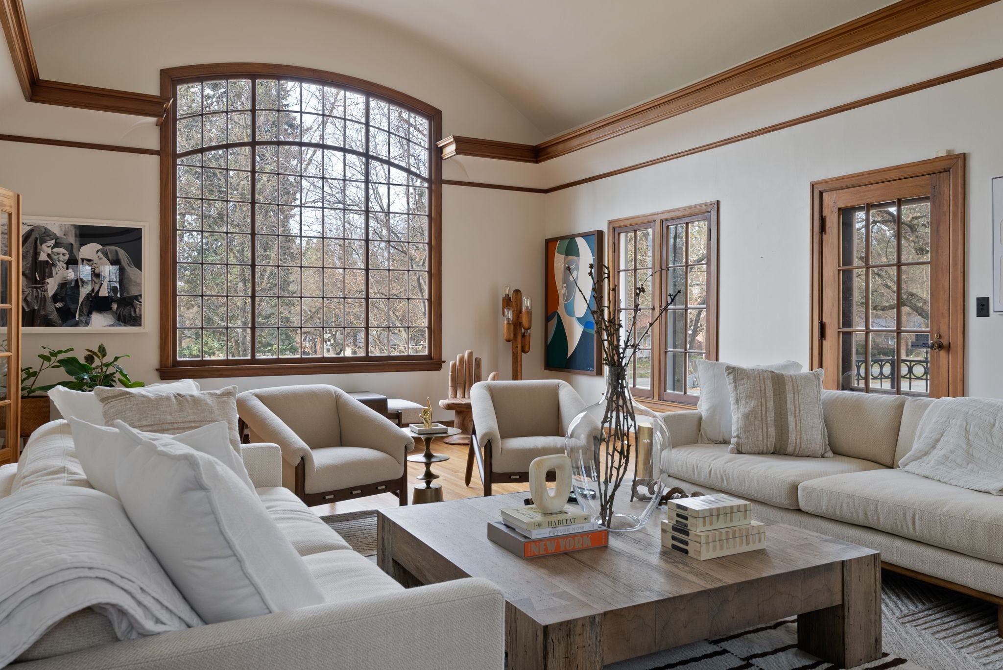a beautiful bright living room space after day with a designer