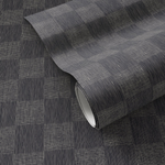 Black checkerboard wallpaper with fine light-colored linework, shown partially rolled.